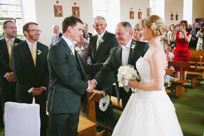 father of the bride giving daughter away wedding ceremony